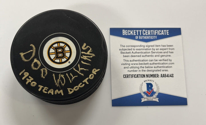 Earl Doc Wilkins Signed Puck Autographed Boston Bruins Team Doctor Beckett COA