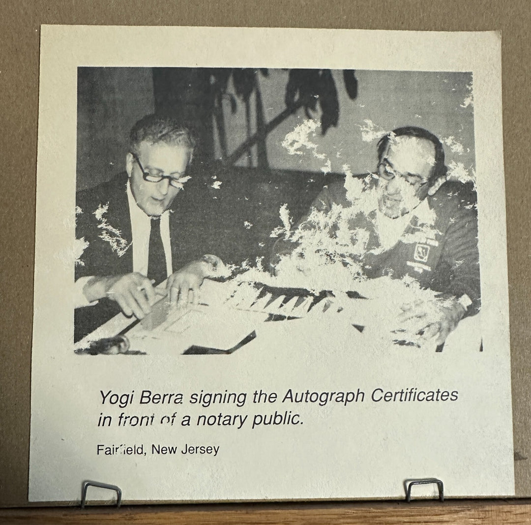 Yogi Berra Autographed Stat Sheet W/ Picture of Signing on Back Notary COA