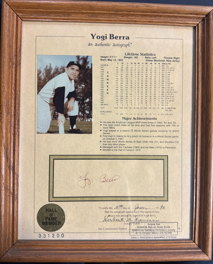 Yogi Berra Autographed Stat Sheet W/ Picture of Signing on Back Notary COA